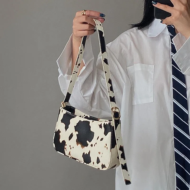 Cow spot pattern shoulder bag