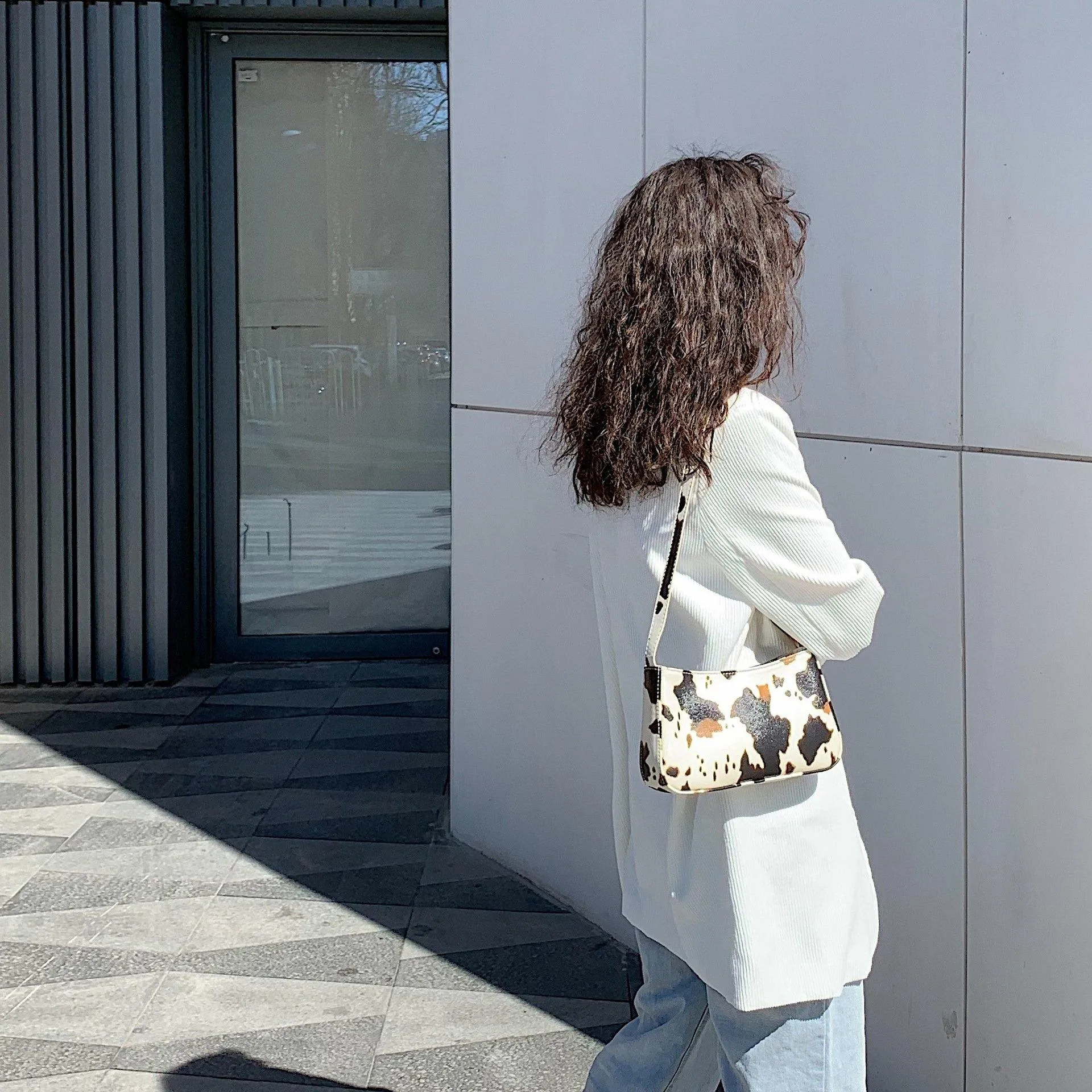 Cow spot pattern shoulder bag