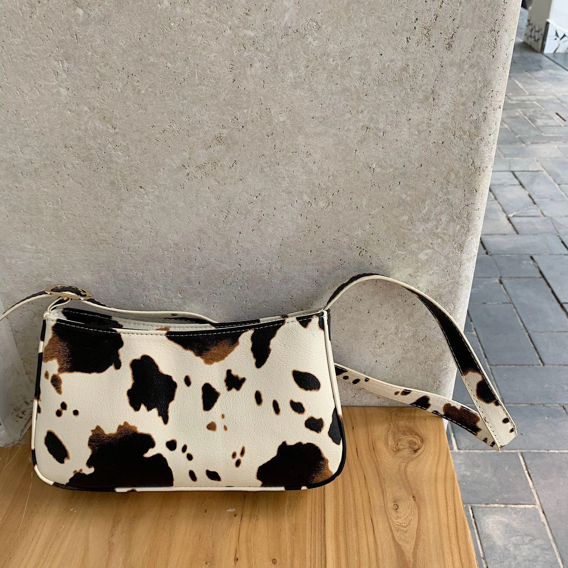 Cow spot pattern shoulder bag