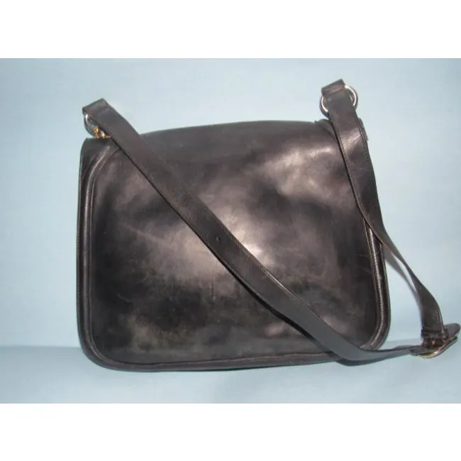 RARE, vintage, supple, black leather, Gucci 'Blondie' saddle bag style shoulder bag with an XL, gold 'GG' logo cut-out